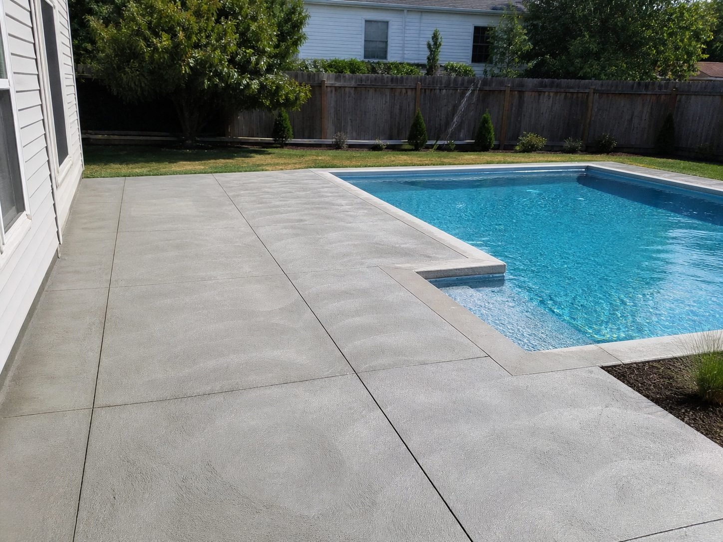 Finished concrete patio installed in Gladstone, MO — clean outdoor living space